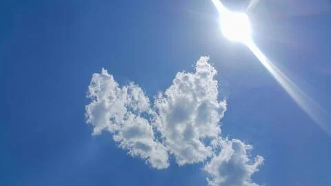 Heart-shaped clouds Stock Photos