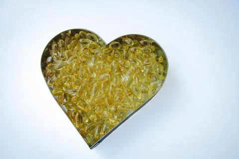 A heart shaped container filled with numerous transparent. Foto stock