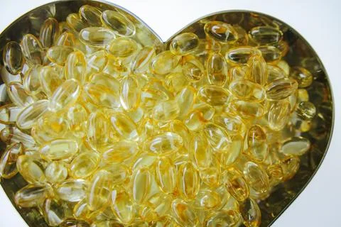 A heart shaped container filled with numerous transparent. Stock-Fotos