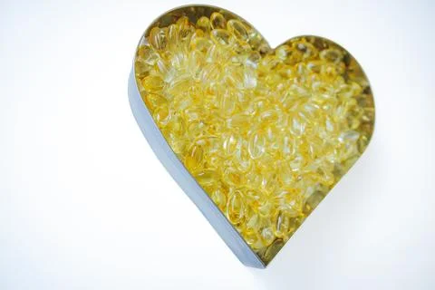 A heart shaped container filled with numerous transparent. Foto stock