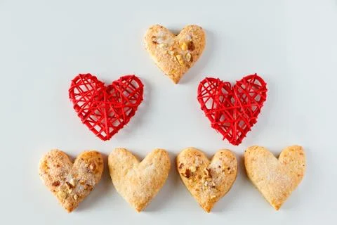 Heart shaped cookie pattern on a white background Foto stock