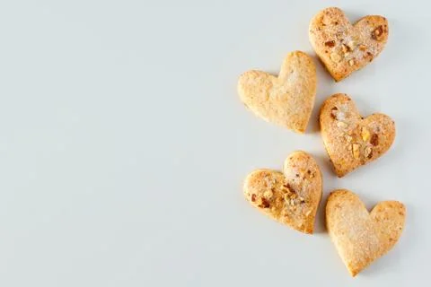 Heart shaped cookie pattern on a white background Stock Photos