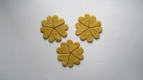 Heart shaped cookies pattern appears on a white background stop motion animation Stock Footage 72223908