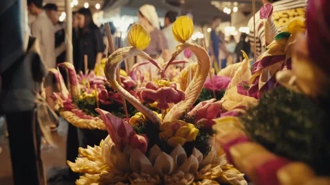 Heart shaped double swan krathong, night market background Stock Footage 346665266