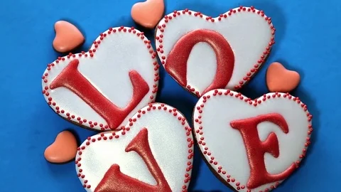 Heart-shaped gingerbread cookies on rotating surface. Video stock 73235693