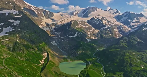Heart shaped lake in the mountains. Drone flying over beautiful lake. Mountain 스톡 동영상 311370943