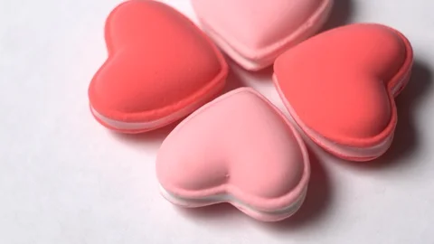 Heart shaped macaroons rotate on a white background. Stock Footage 123724263