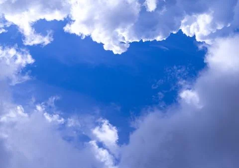 Heart-shaped opening in the sky Stock Photos