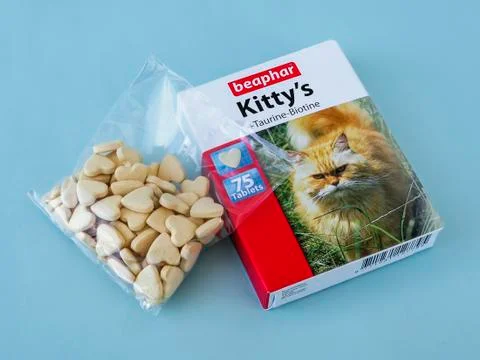 Heart shaped pills of complementary feed for cats with taurine, biotine Stock Photos