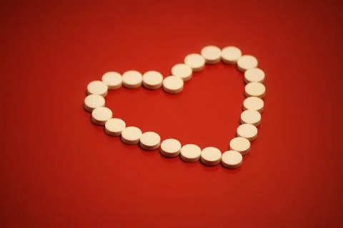 Heart shaped pills Stock Photos