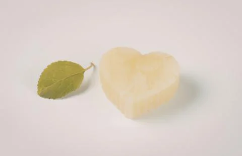Heart shaped pineapple slice with mint leaf Stock Photos