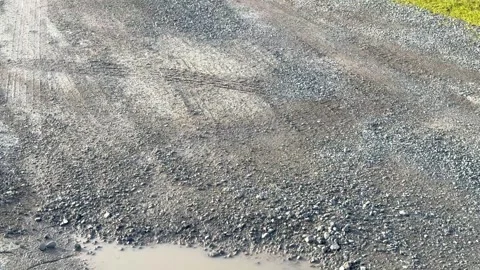 Heart-Shaped Puddle in road Stock Footage 307963090