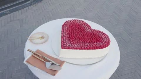 Heart-Shaped Raspberry Cake on Elegant Outdoor Table – Romantic Dessert Stock Stock Footage 336399550