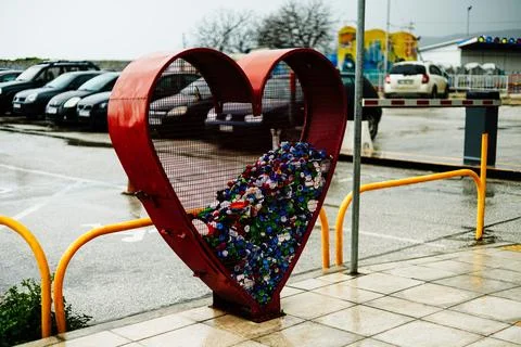 Heart Shaped Recycling Container for Plastic Bottle Caps in City Stock Photos