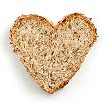 Heart shaped slice of brown bread Stock Photos