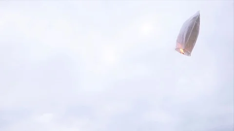 The heart shaped white sky lantern flying in the sky Stock Footage 76851020