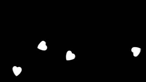 Heart shapes floating acros the frame with a black background Stock Footage 133506795