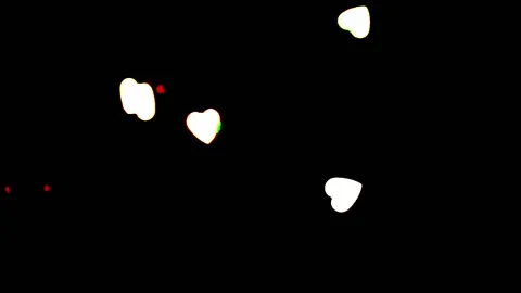 Heart shapes floating acros the frame with a black background Stock Footage 133506809
