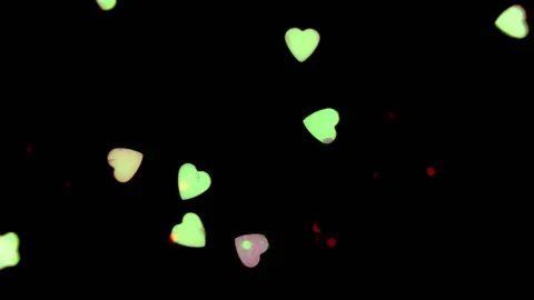 Heart shapes floating acros the frame with a black background Stock Footage 133506852