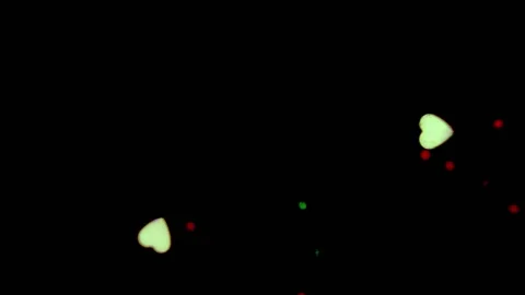 Heart shapes floating acros the frame with a black background Stock Footage 133507009
