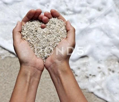 Heart shaping female hands Stock Photos