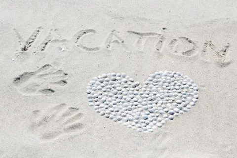 Heart of shells on the beach Stock Photos