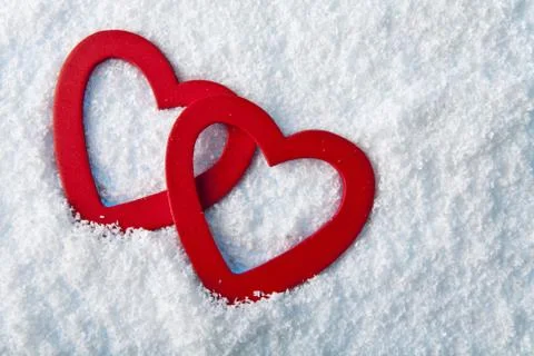 Heart in to snow Stock Photos