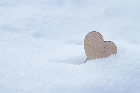 Heart on snow Stock Photos