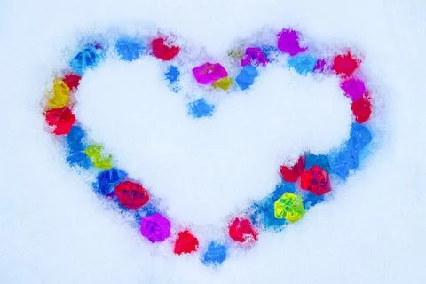Heart on snow Stock Photos