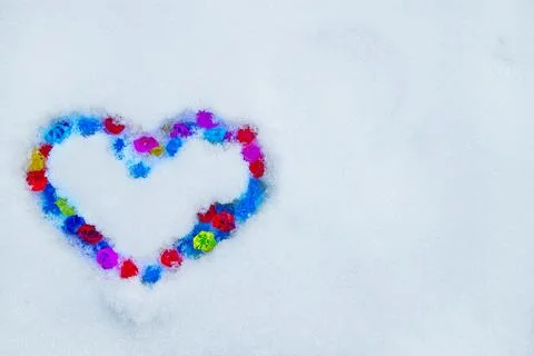 Heart on snow Stock Photos