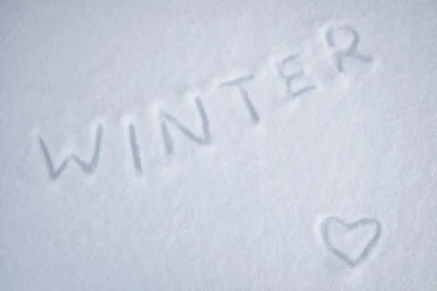 Heart on snow white and the text winter Stock Photos