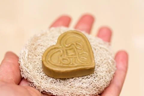 Heart soap on the sponge Stock Photos