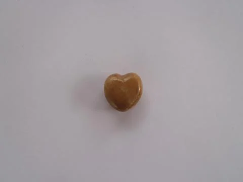 A heart of stone on a white background Stock Photos