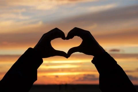 Heart at sunset Stock Photos