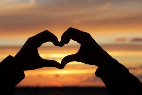 Heart at sunset Stock Photos
