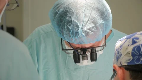 Heart surgery. Medium plan of a surgeon with assistants. Stock Footage 137216296