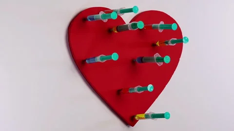 Heart with syringes. Use for heart problem or illness concept Stock Footage 107229533