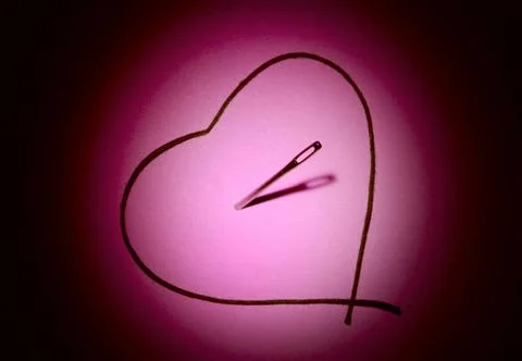 Heart Thread and needle (in the form of heart). A beautiful art background... Foto stock