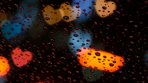 (Heart Variation) Defocused colorful heart shaped city lights in rain. Video stock 61663442