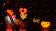 (Heart Variation, Pan) Defocused Colorful Heart Shaped City Lights In Rain. Stock Footage