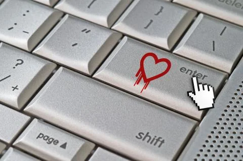 Heartbleed exploit concept mouse cursor pressing enter key on metallic keyboa Foto stock