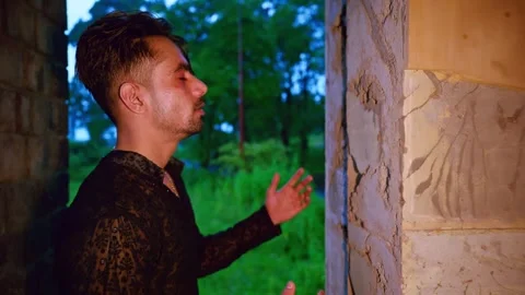Heartbroken Man Dances Alone by Cave Wall Stock Footage 311146447