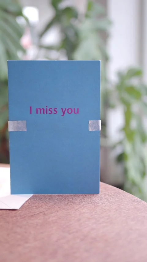 Heartfelt card expressing feelings of missing someone Stock Footage 313574181