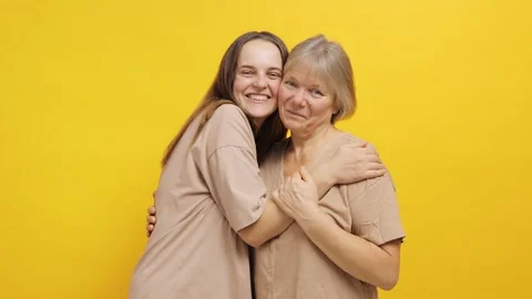 A heartfelt interaction unfolds between a daughter and her mother in a bright Видео 291706446