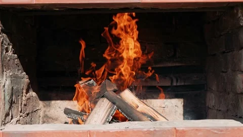 A hearth burns in the brick brazier, firewood crackles from the fire. A Stock Footage 200452173