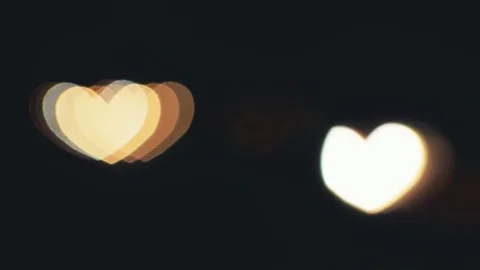 Hearth shaped bokeh of car lights at night. Stock Footage 80477730