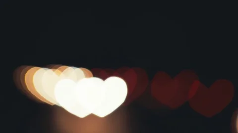 Hearth shaped bokeh of car lights at night. Stock Footage 80477736
