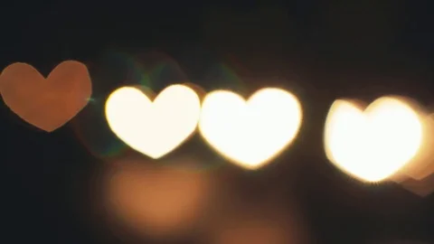 Hearth shaped bokeh of car lights at night. Stock Footage 80477789