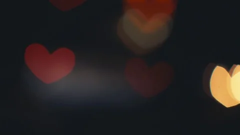 Hearth shaped bokeh of car lights at night. Stock Footage 80477812