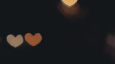 Hearth shaped bokeh of car lights at night. Stock Footage 80482672